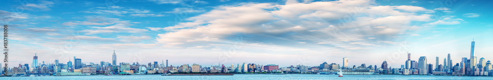 Panoramic sunset view of New York City skyline from Jersey City
