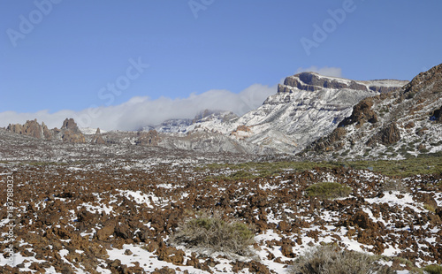 Teide National Park or Las Canadas del Teide in winter, views towards Llano de Ucanca and lava Aa covered with a thin layer of snow, Tenerife, Canary Islands, Spain