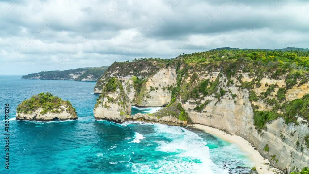 Timelapse Rocky coast with big waves at Atuh beach on Nusa Penida island, Indonesia Timelapse Rocky coast with big waves at Atuh beach on Nusa Penida island, Indonesia