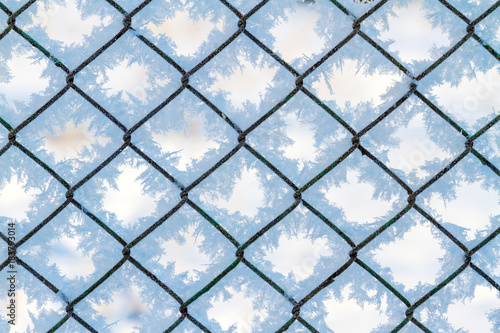 Winter frost texture on a metal grid