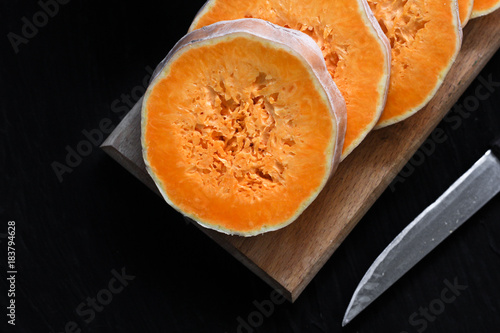 fresh pumpkin chopped on a round piece