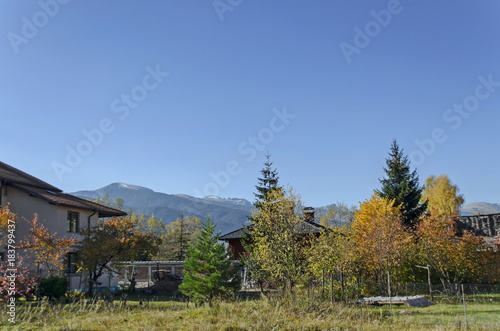 Scene with mountain top, valley, forest, glade and residential district of bulgarian village Govedartsi, Rilamountain, Bulgaria 