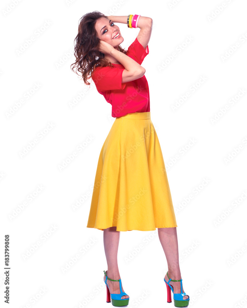 Beautiful woman with curly hair wearing a red jacket, isolated on white background