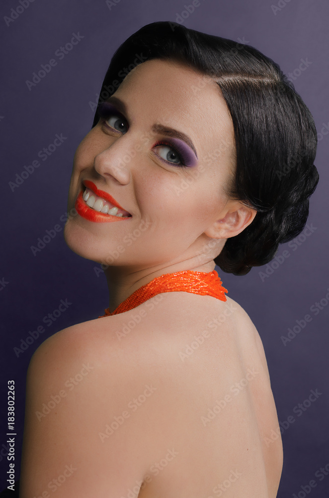 Portrait of attractive sensual glamour retro elegant young adult smiling woman with classic hairstyle and orange lips