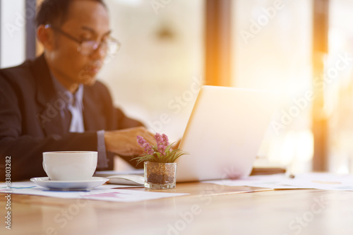 Businessman typing on laptop at workplace man working in home office hand keyboard  Hands of young people typing on laptop in the office 