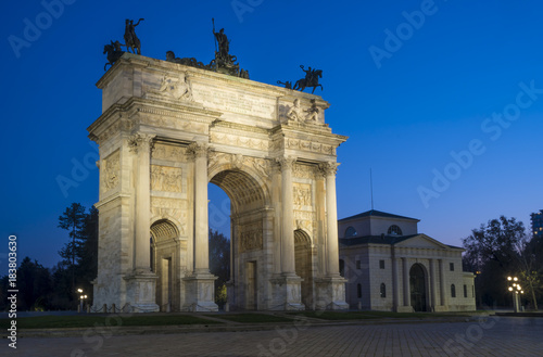 Arch of Peace (Arco della Pace) in Sempione Park with Sforza castle in the background, Milan, Italy. Night view.