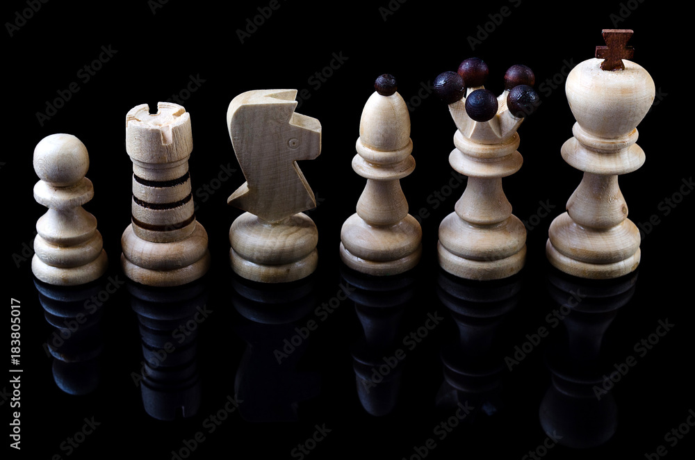 Wooden chess is isolated on a black background: king, queen, bishop, knight, castle, pawn. Wooden chess is isolated on a black background: king, queen, bishop, knight, castle, pawn.