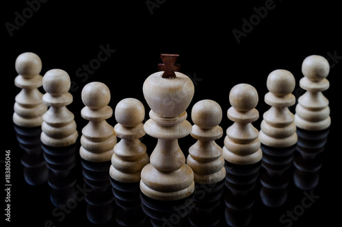 Wooden chess isolated on a black background.