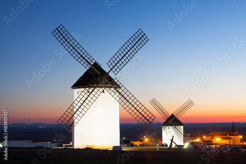  windmills at field in sunset
