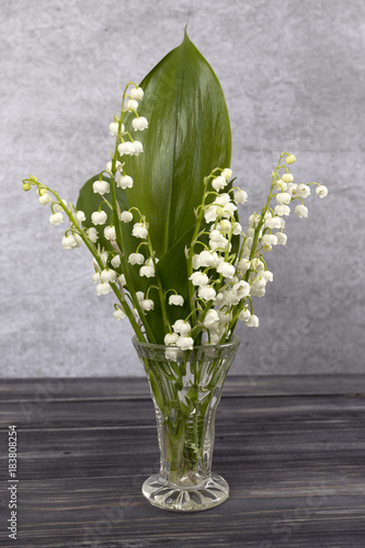 Bouquet of lilies of the valley on the wooden