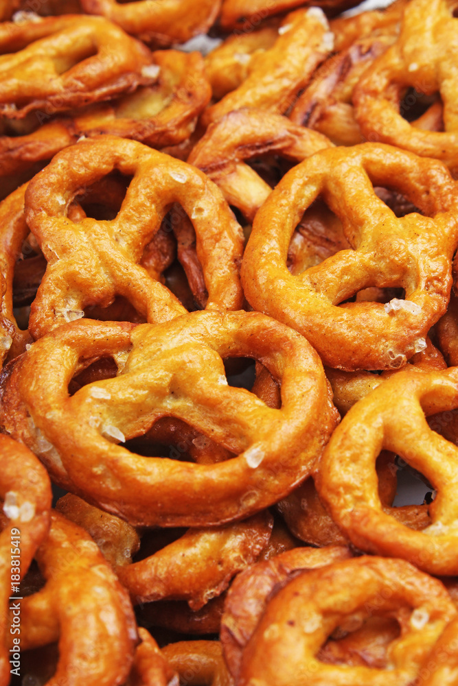 Pretzel shaped bread sticks cracker texture pattern. Salted pretzels. Food photo. Pretzel shaped bread sticks cracker texture pattern. Salted pretzels. Food photo.