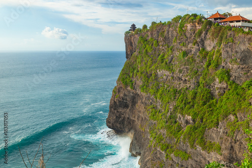 Beautiful view of Uluwatu temple and ocean rocky cliff. Scenic landscape of fantastic view. Bali, Indonesia.