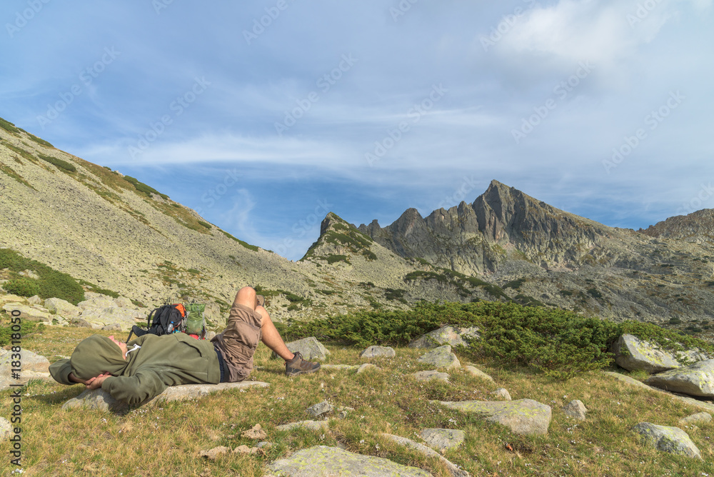 Hiker taking a nap in the mountain