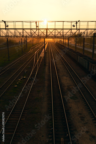 Beautiful sunset on the background of railway tracks