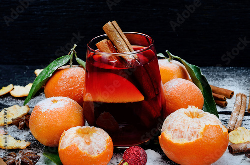 glass of wine with cinnamon on table