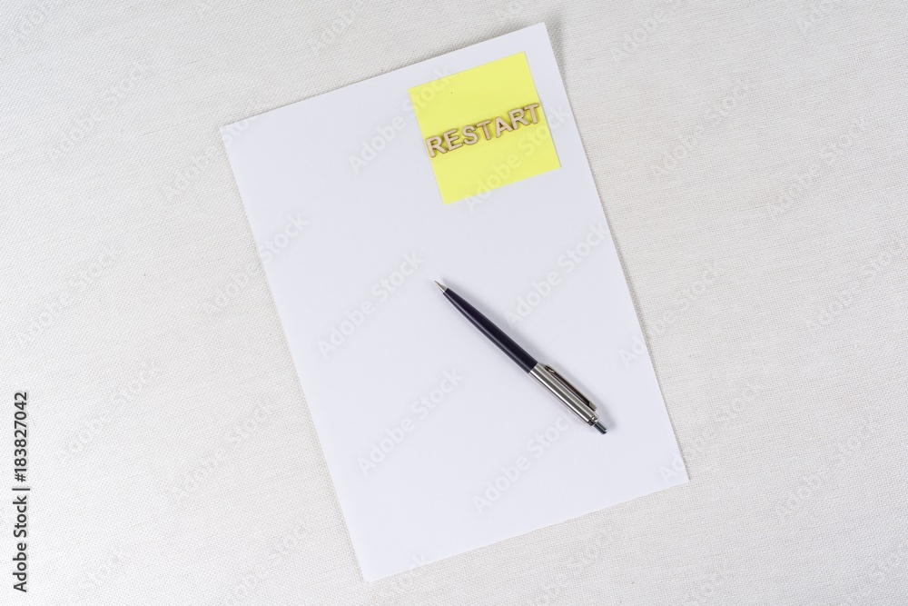 Clean paper, sticker with the word restart. Business concept Clean paper, sticker with the word restart. Business concept