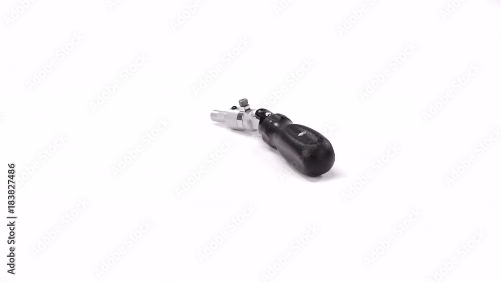 close up shot of a swivel key ratchet pivot for a hex head, the tool has a black handle close up shot of a swivel key ratchet pivot for a hex head, the tool has a black handle