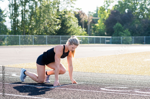 Young Female Athlete Working Out on Track