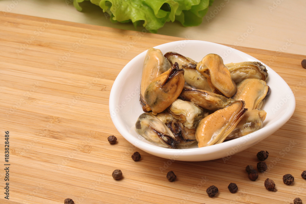 Mussels in oil on a plate