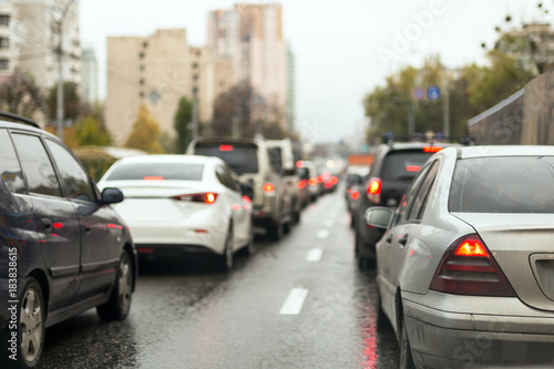 Traffic jam on a city street  on wet  road after rain © Kirill Gorlov