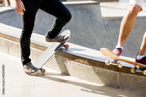 Teenage boy skateboarding outdoors © Sergey Nivens