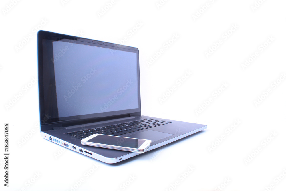 Office workplace with laptop, smart phone on table Office workplace with laptop, smart phone on table