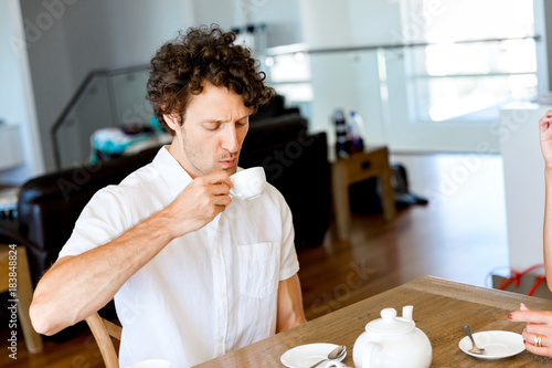 Man having tea at home