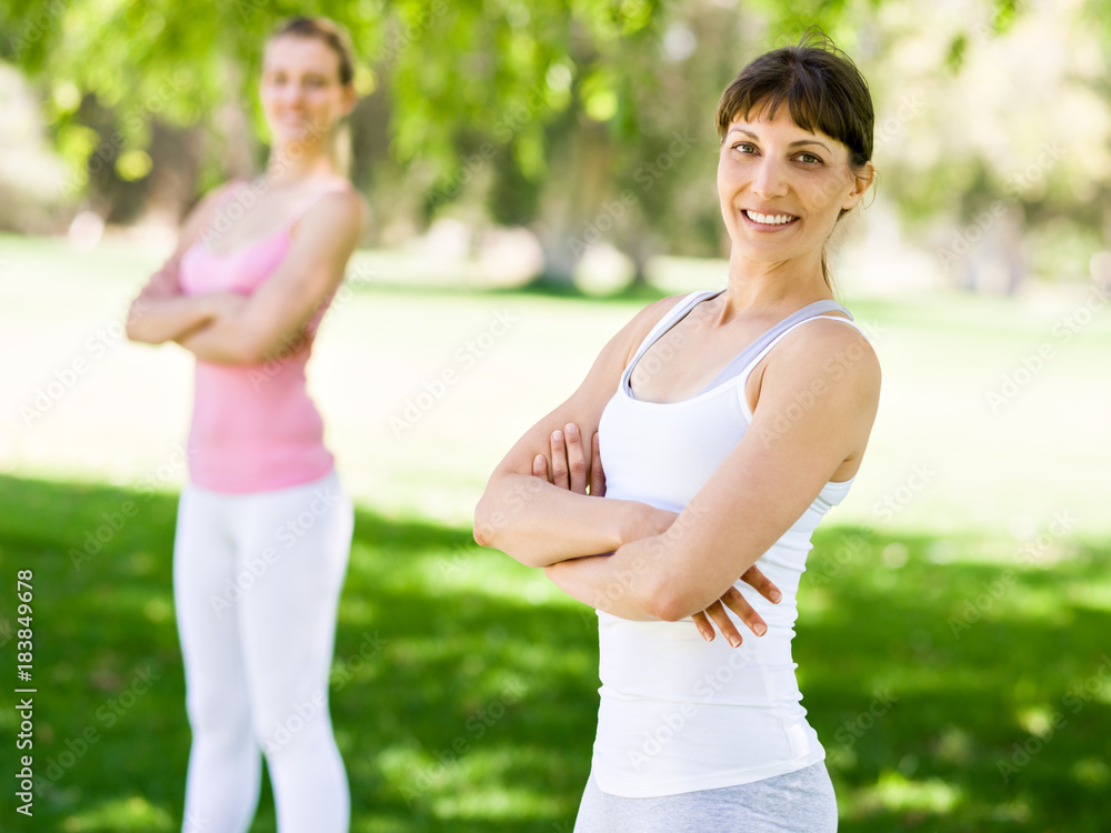 Fototapeta premium Young women exercising in the park