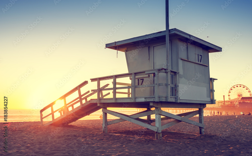 Fototapeta premium Santa Monica beach lifeguard tower in California USA at sunset