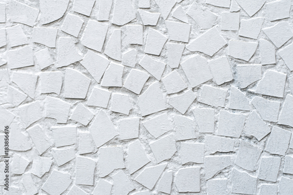 The texture of paint mosaic wall decorative ornament from ceramic broken tile. Can be used as a background in interior design. Exterior of the facade of the house. The texture of paint mosaic wall decorative ornament from ceramic broken tile. Can be used as a background in interior design. Exterior of the facade of the house.