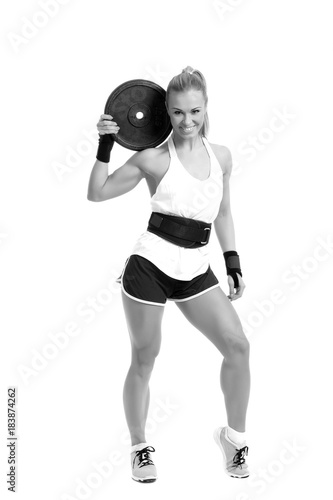 Athletic woman doing workout with weights