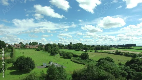 A drone shot of a beautiful green park under a sunny day. photo