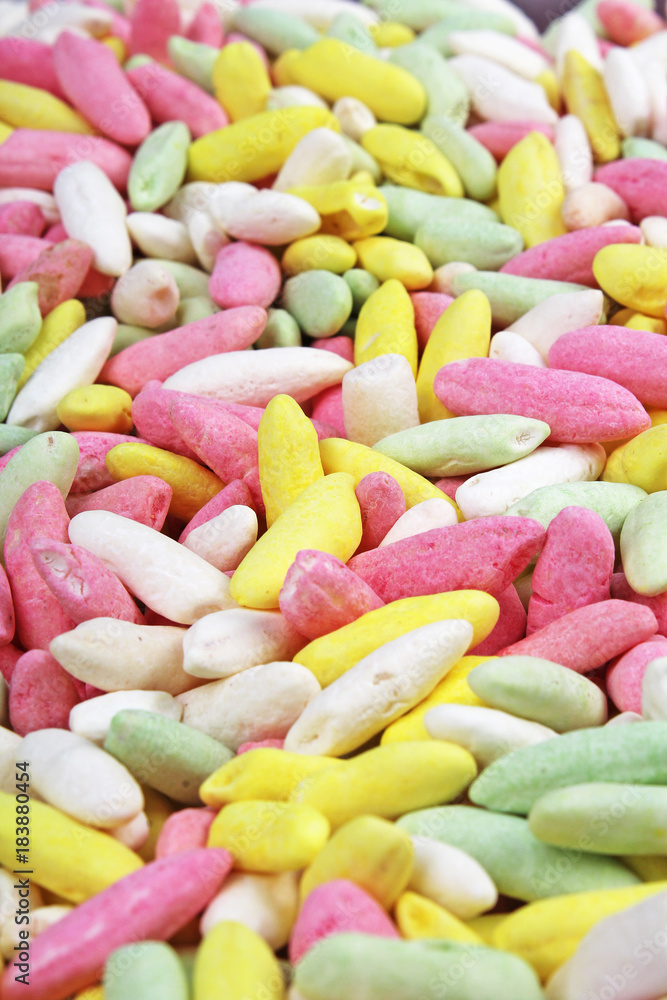 Candy from puffed rice grains. Sweet flavored puffed rice grains. Colorful snack. Sweets. Candy from puffed rice grains. Sweet flavored puffed rice grains. Colorful snack. Sweets.