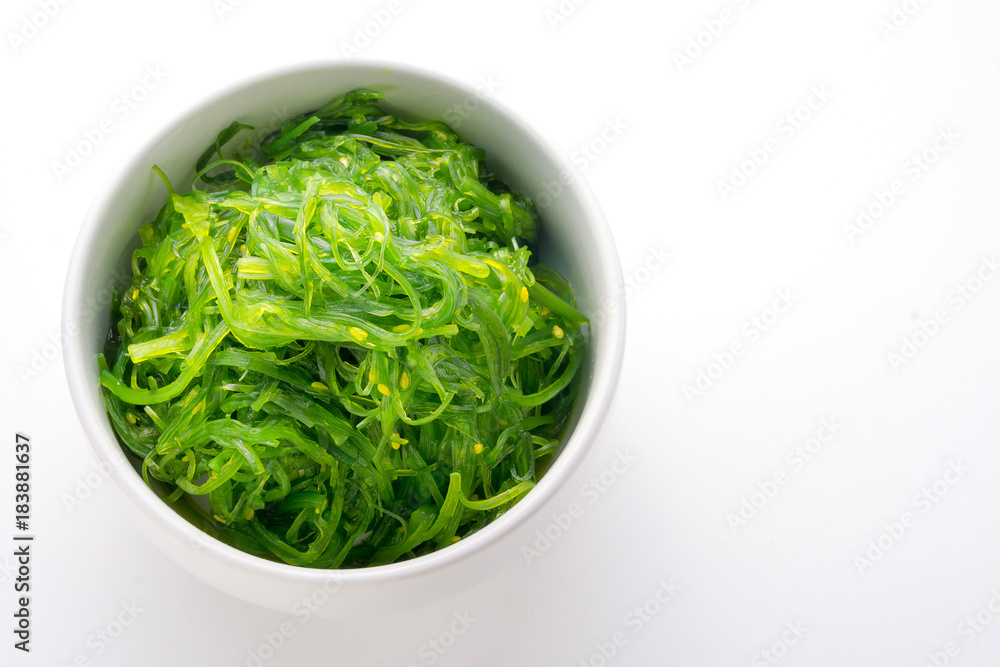Hiyashi Wakame Chuka or seaweed salad in bowl on white background , Japanese food Hiyashi Wakame Chuka or seaweed salad in bowl on white background , Japanese food