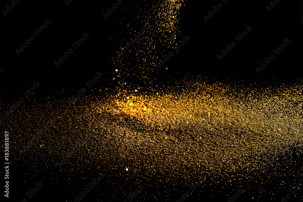 Sprinkle glitter gold dust in the dark textured abstract background elegant for Merry christmas and Happy new year Sprinkle glitter gold dust in the dark textured abstract background elegant for Merry christmas and Happy new year