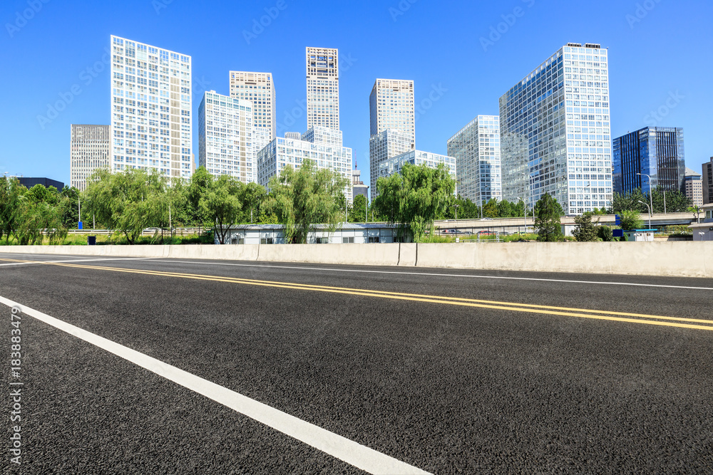 Asphalt road and modern city commercial buildings in Beijing,China Asphalt road and modern city commercial buildings in Beijing,China