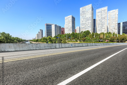 Asphalt road and modern city commercial buildings in Beijing,China