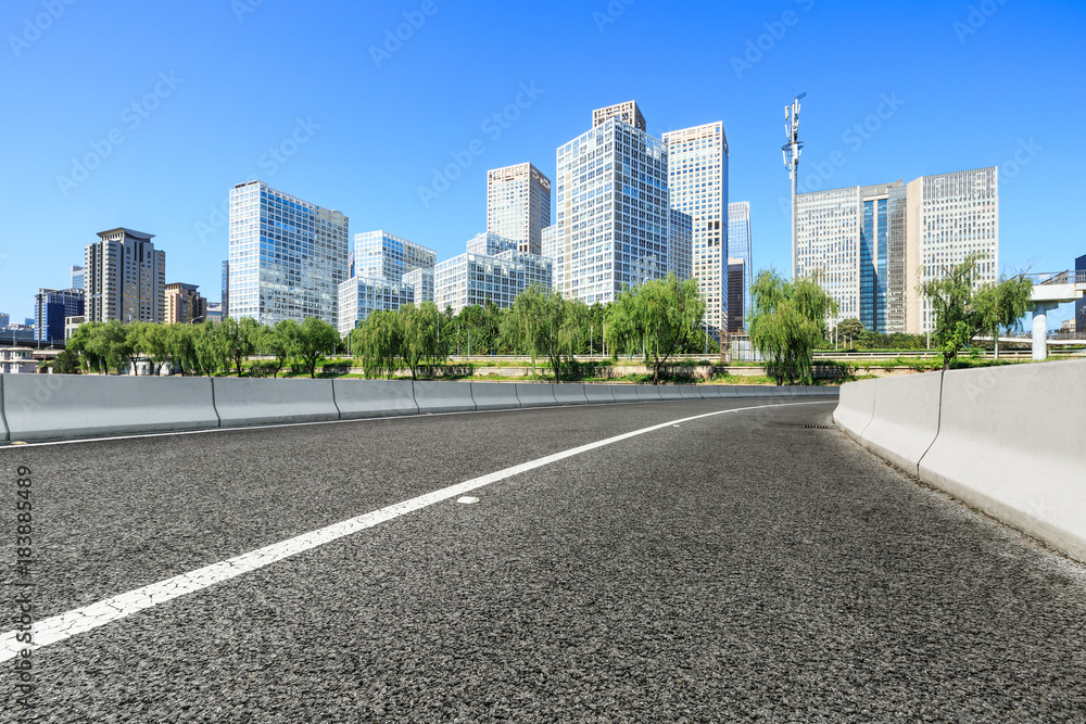 Asphalt road and modern city commercial buildings in Beijing,China Asphalt road and modern city commercial buildings in Beijing,China