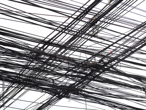 The chaos of cables and wires on every street in Bangkok, Thailand.
