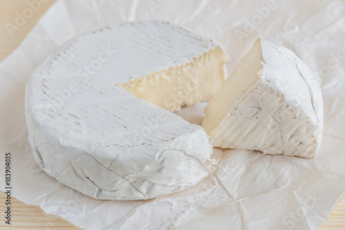 closeup of camembert on white paper