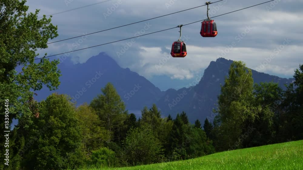 Alpine cable car gondola passing Lake Lucerne hills of Pilatus in Swiss Alps in Switzerland Alpine cable car gondola passing Lake Lucerne hills of Pilatus in Swiss Alps in Switzerland