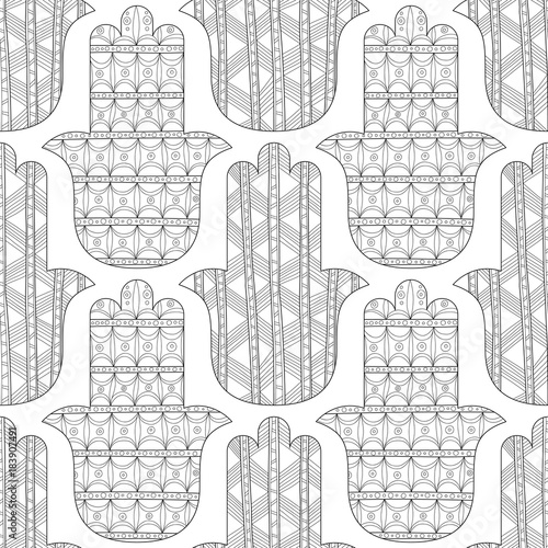 Hamsa hand. Black and white seamless pattern for coloring page. Decorative amulet for good luck and prosperity. photo