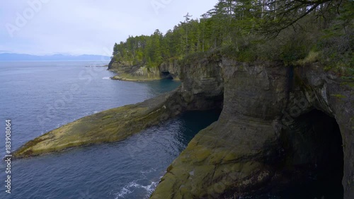 Incredible landscape of the coast. Beautiful blue sea. The waves rolled ashore and breaking on the rocks. Olympic Peninsula, Cape flattery trail. 4K, 3840*2160, high bit rate, UHD