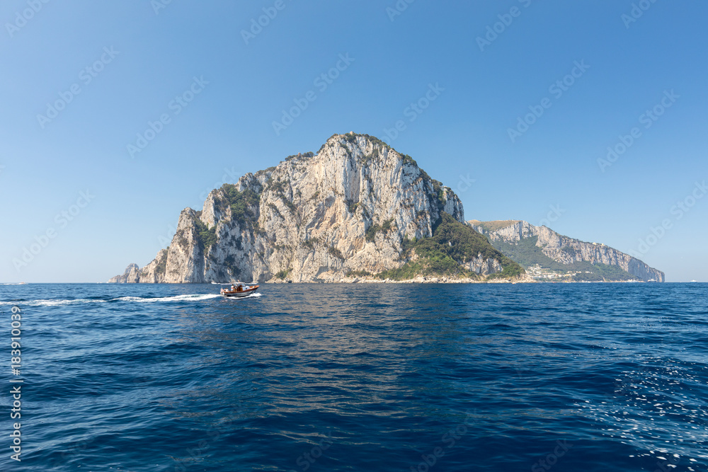 The Island of Capri is a very picturesque, luxuriant and extraordinary location in Italy famous for its high rocks. The Island of Capri is a very picturesque, luxuriant and extraordinary location in Italy famous for its high rocks.
