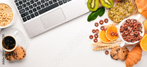 Wallpaper Mural Business breakfast, muesli, coffee, milk, fruits, nuts and seeds, on a wooden surface. Top view. Free space for text. Torontodigital.ca