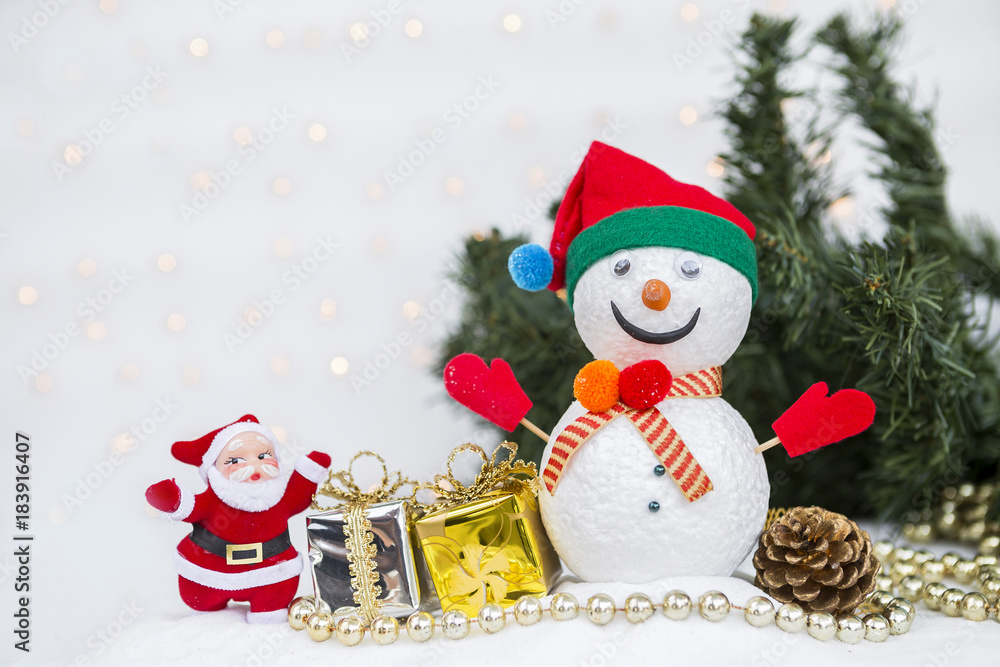 Christmas concept background of Snowman and Santa Claus with Christmas tree decoration over blurred light bokeh on white background