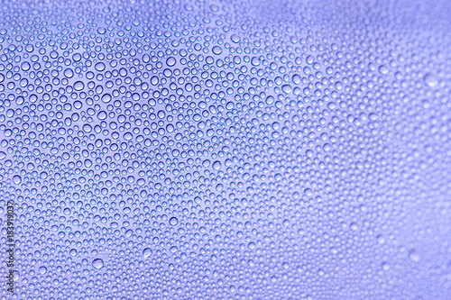 Water backgrounds with water drops. Blue water bubbles on window glass.