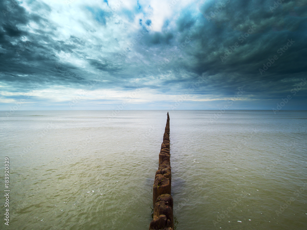 Obraz premium Old fishing boat pier at Baltic sea coast.