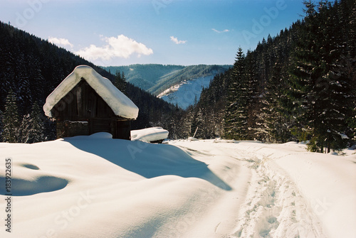 Summer house of shepherd, covered with snow