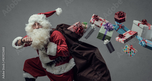 Santa Claus running and delivering gifts